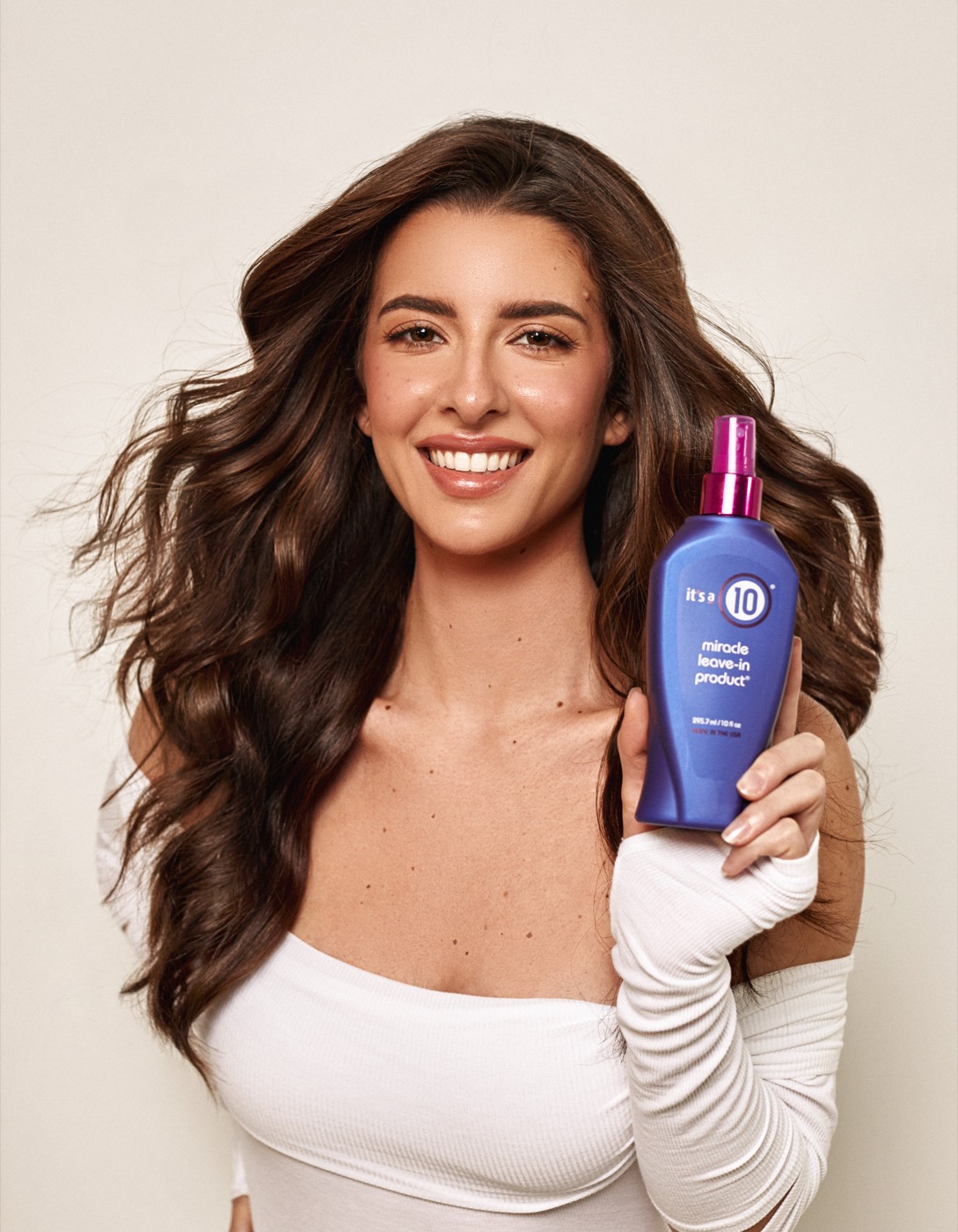 It's a 10 Miracle Leave-In shown with a model holding the bottle